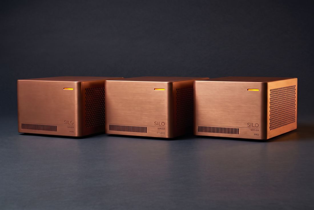 Mini, Studio and Pro units side by side: three identical burnt-copper chassis of the same size, distinguished only by an engraved tier name