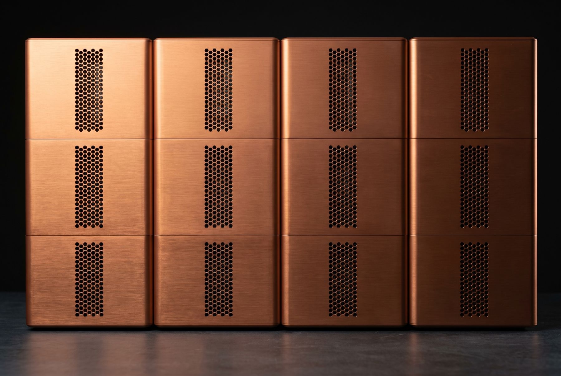 Twelve Silo Server modules joined four wide and three high, their hexagonal vent fields aligned into continuous vertical convection channels